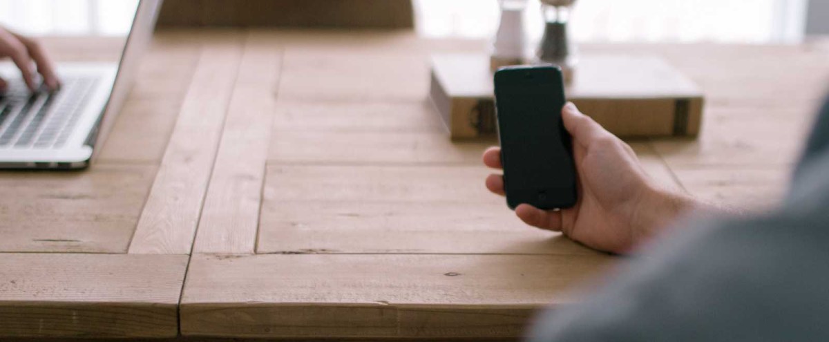 photo of a hand holding a mobile phone